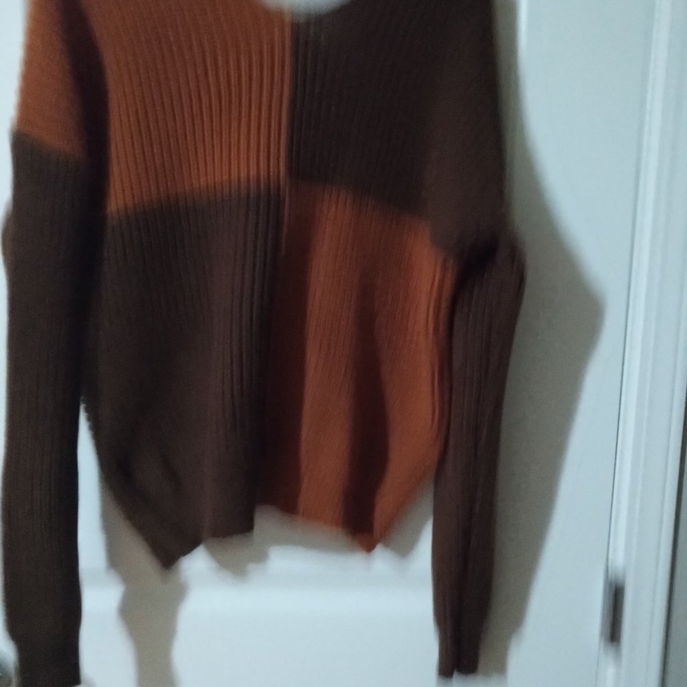 Brown and rust twisted back sweater.